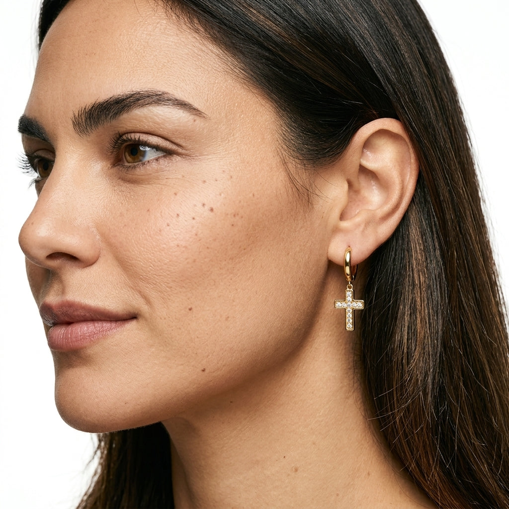 Huggie earrings with cross pendants — On Model - Close-up Detail | Generated by Modelize